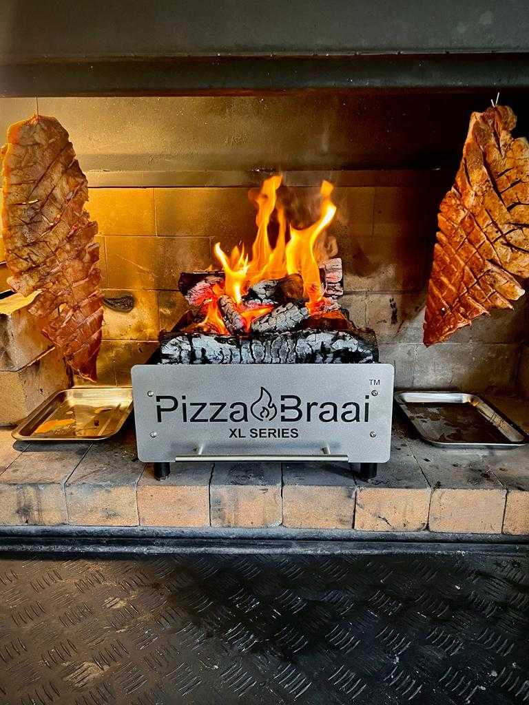 Pizza Braai XL Series cooking over a real braai fire